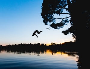 person jumping on lake thumbnail