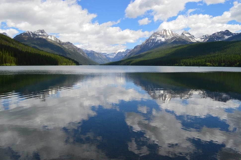 reflection of mountain and clouds on water preview