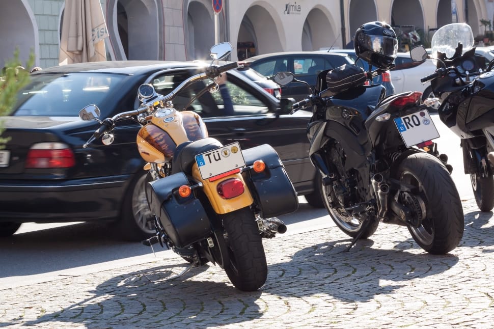yellow touring motorcycle, black yamaha tsx and black kawasaki bajaj pulsar preview