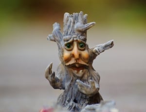 brown and gray ceramic figurine thumbnail