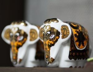 photo of two yellow-and-white ceramic elephant miniatures thumbnail