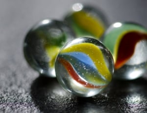 four glass marbles thumbnail