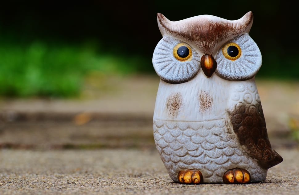 white brown and yellow owl figurine preview