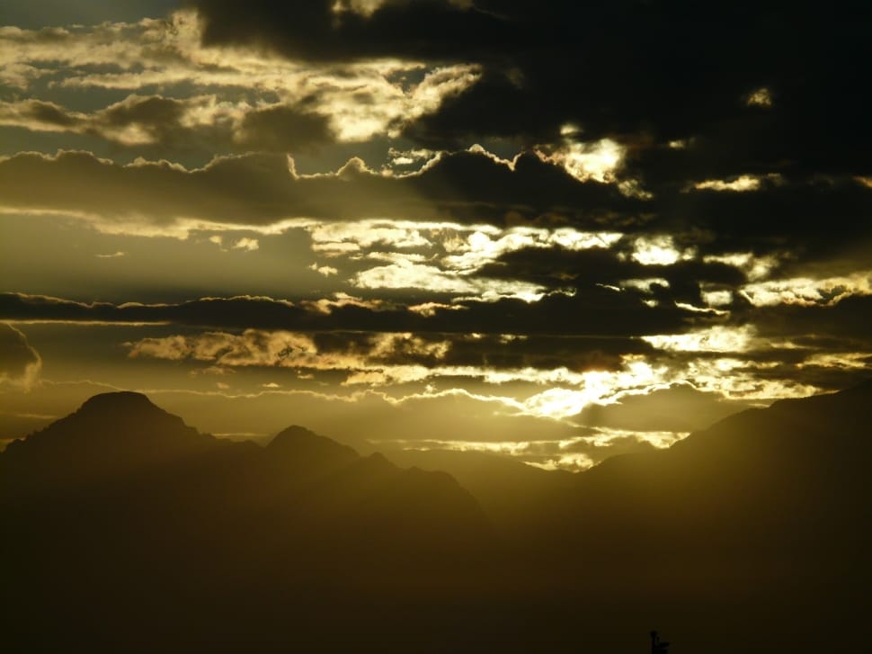 silhouette of mountain ranges during golden hour preview