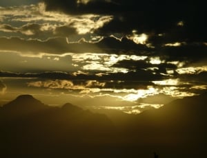 silhouette of mountain ranges during golden hour thumbnail