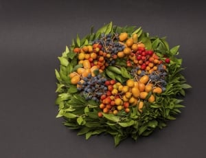 blue red and yellow fruit wreath thumbnail