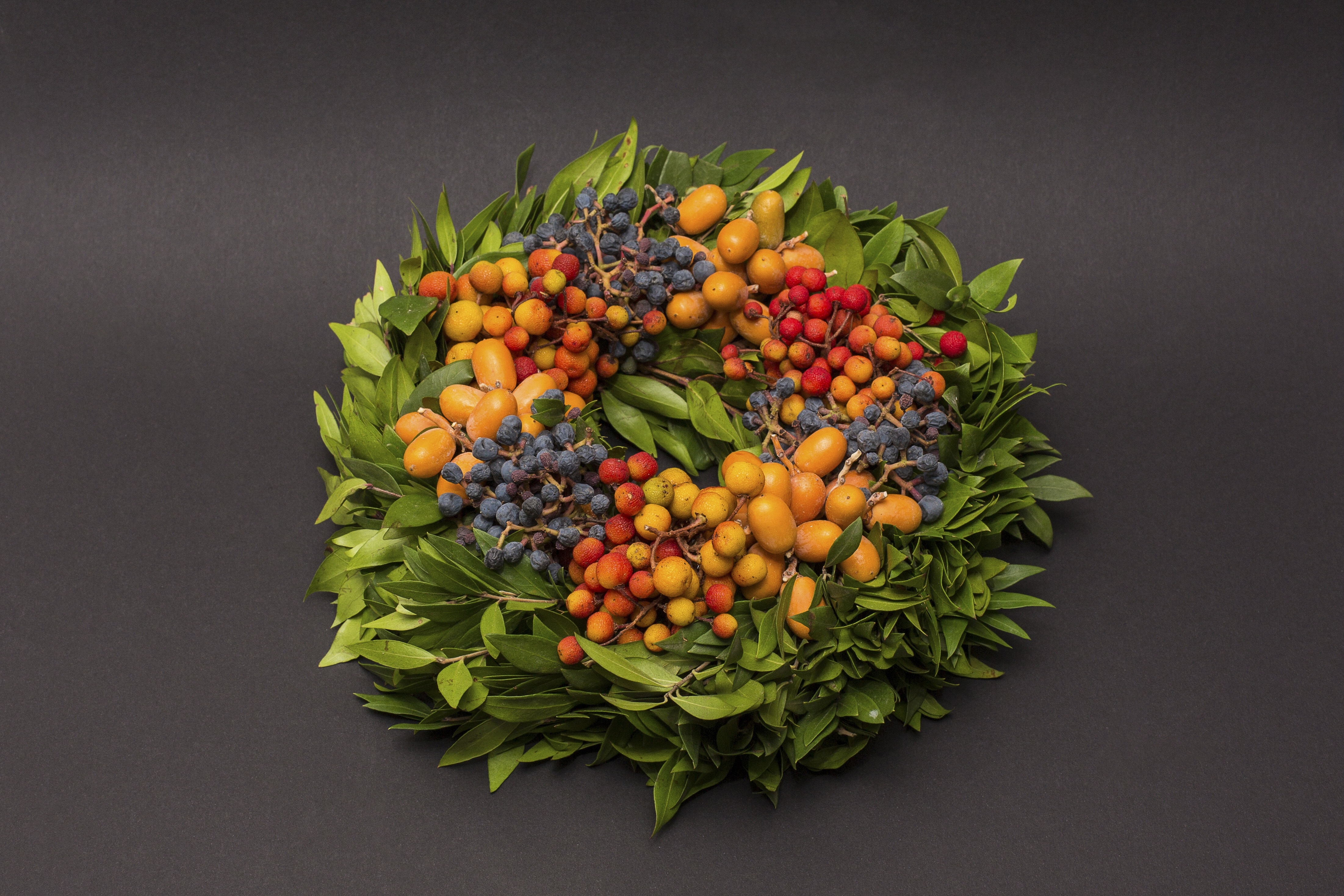 blue red and yellow fruit wreath
