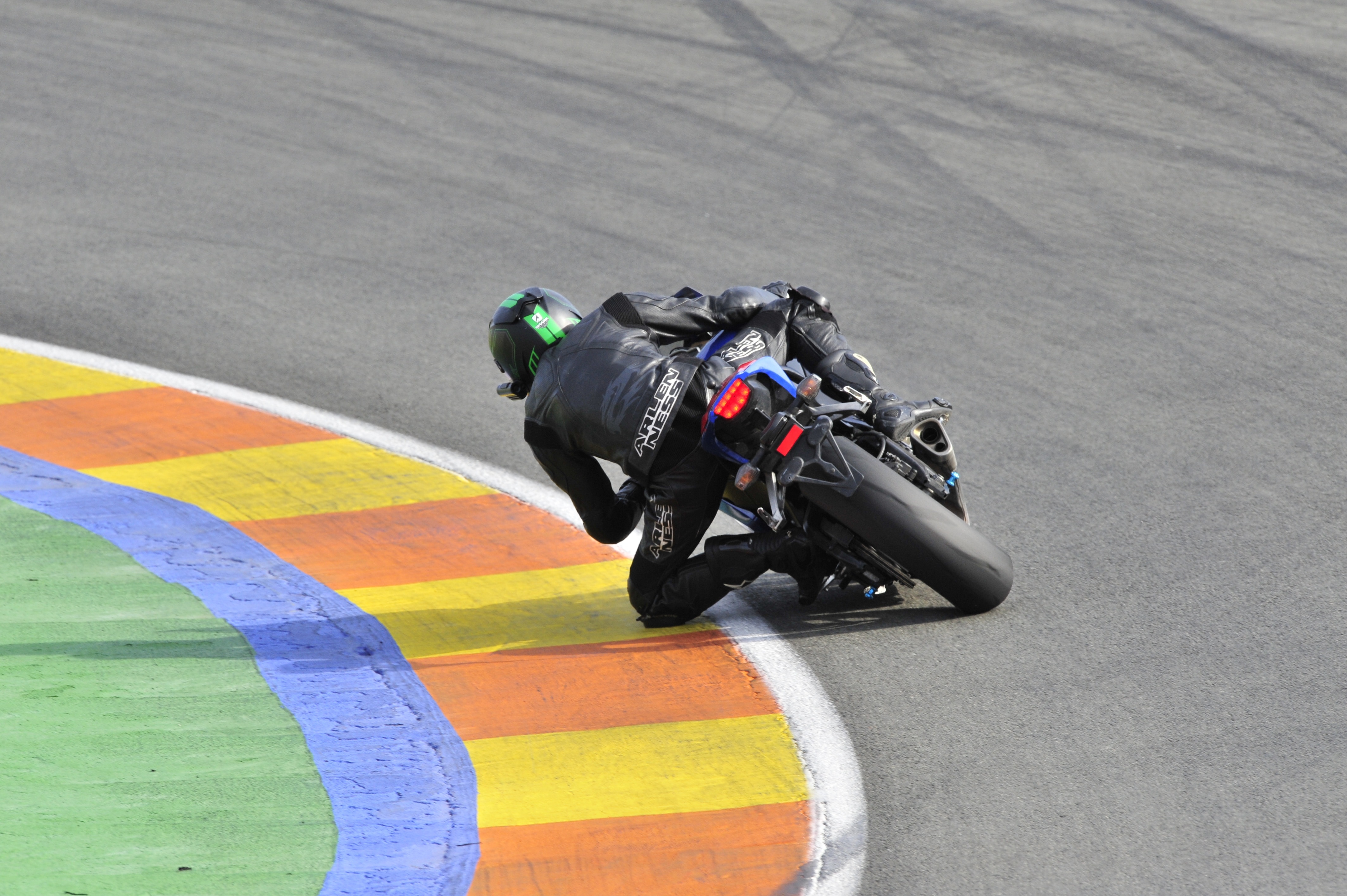 men's black leather racing jacket with black racing motorcycle