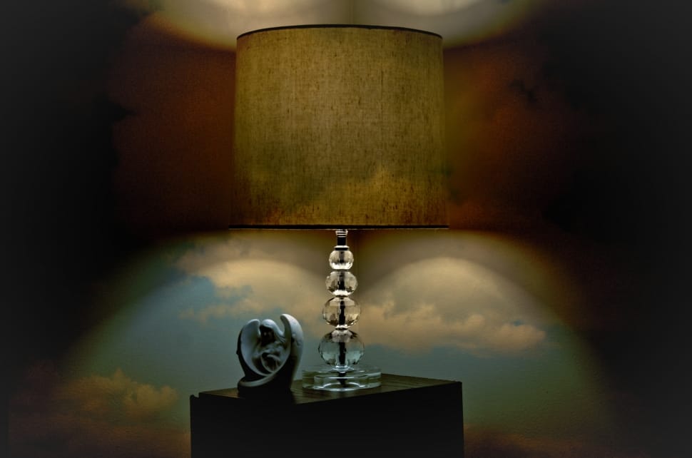 clear glass base table lamp with beige cylindrical lamp shade preview