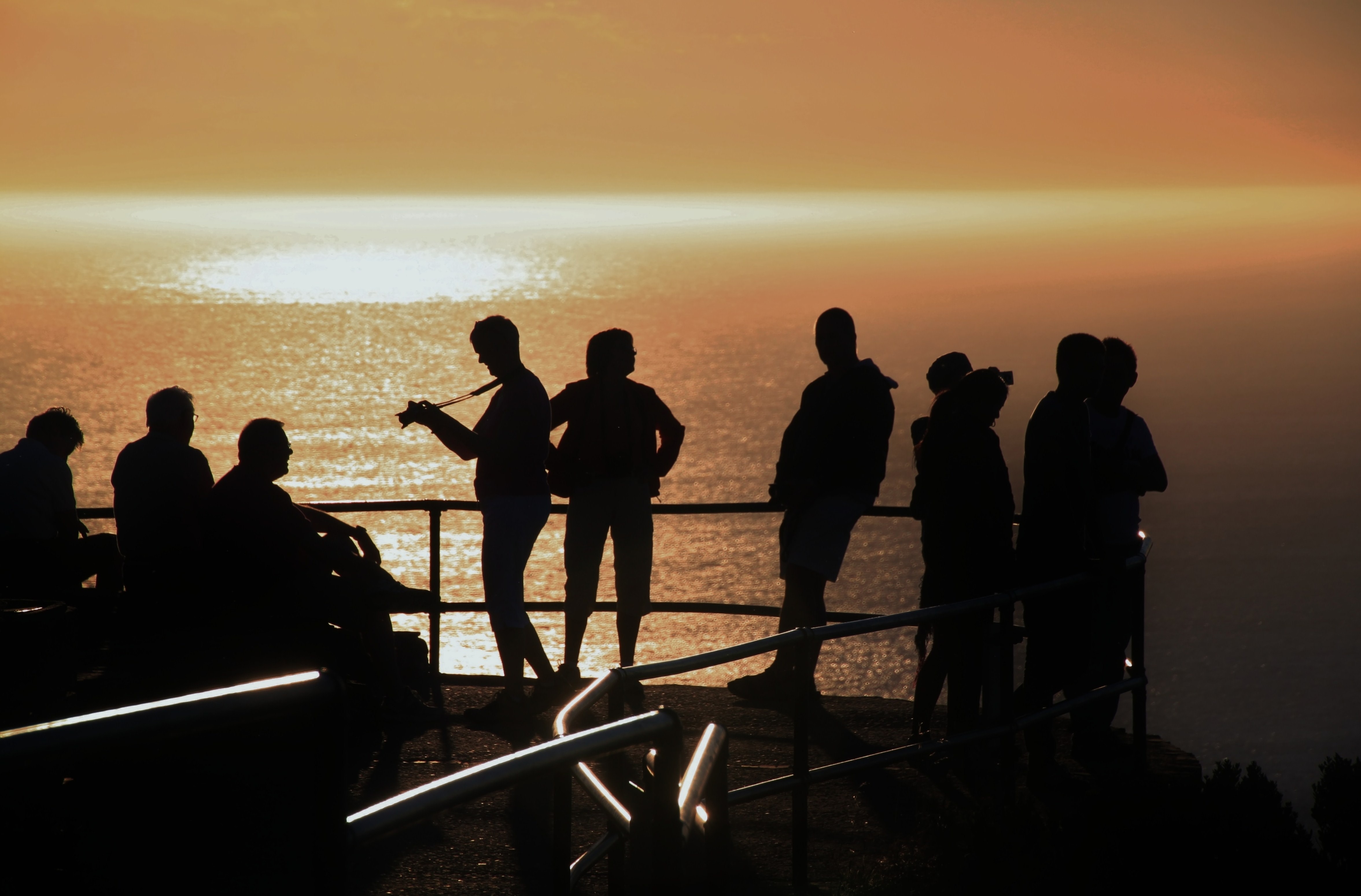 silhouette of 10 person in ship
