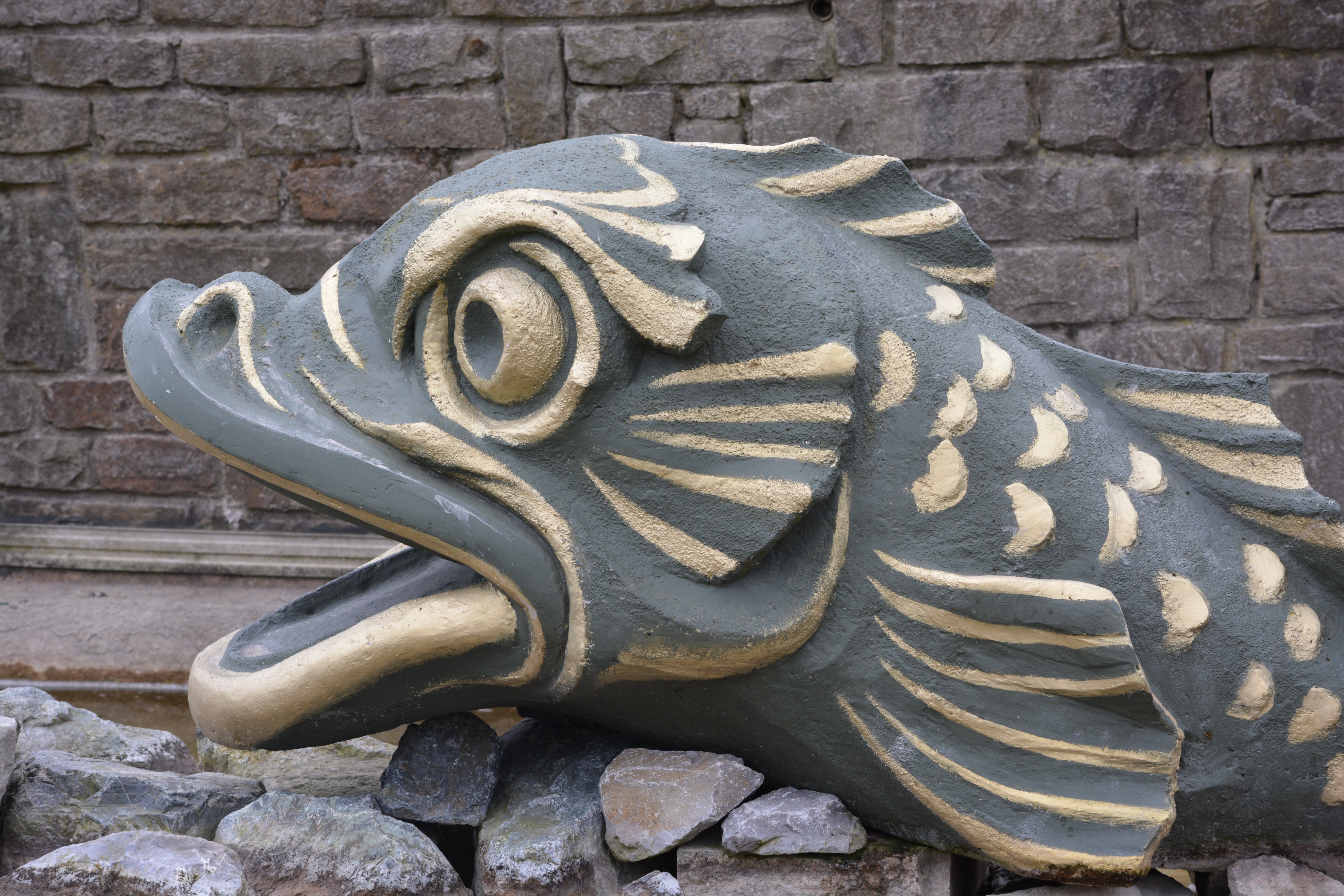 gray and beige fish statue