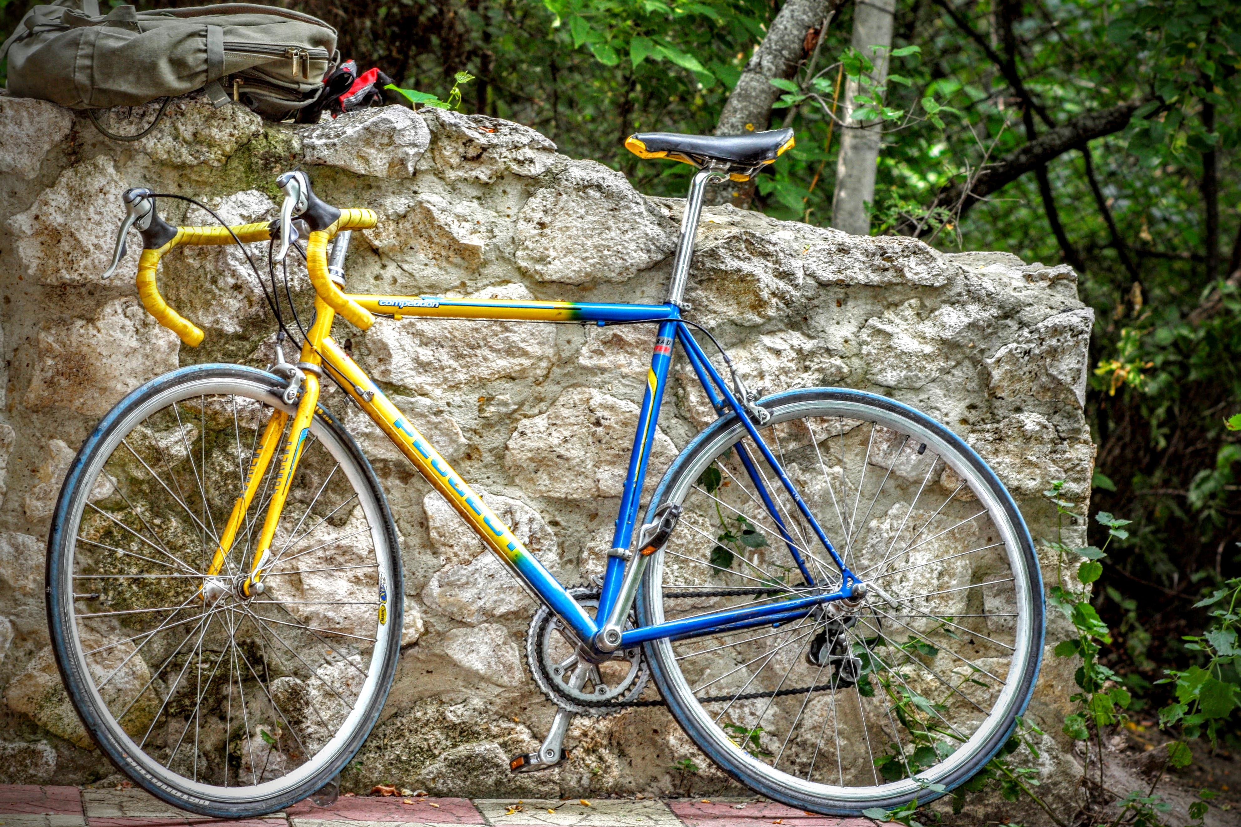 yellow and blue drop bar road bicycle