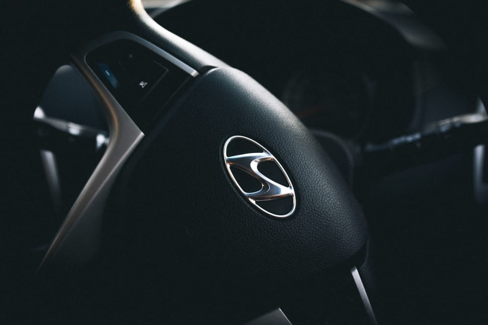 black hyundai multi function steering wheel turning right preview