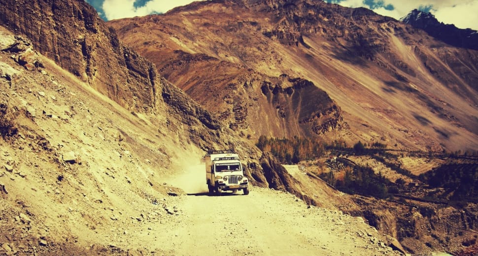 white jeep wrangler in mountain preview