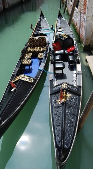 2 black wooden canoes thumbnail