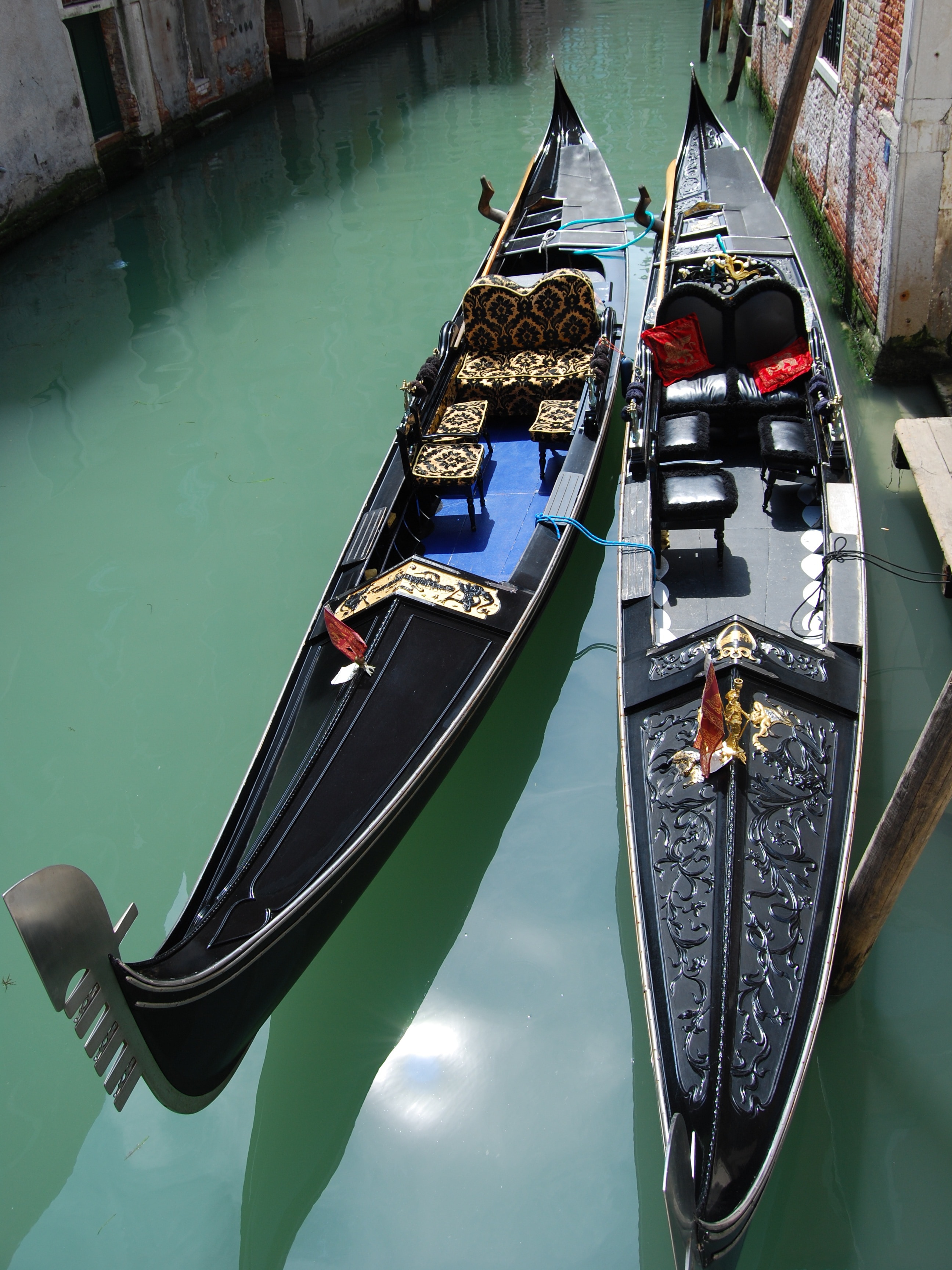 2 black wooden canoes