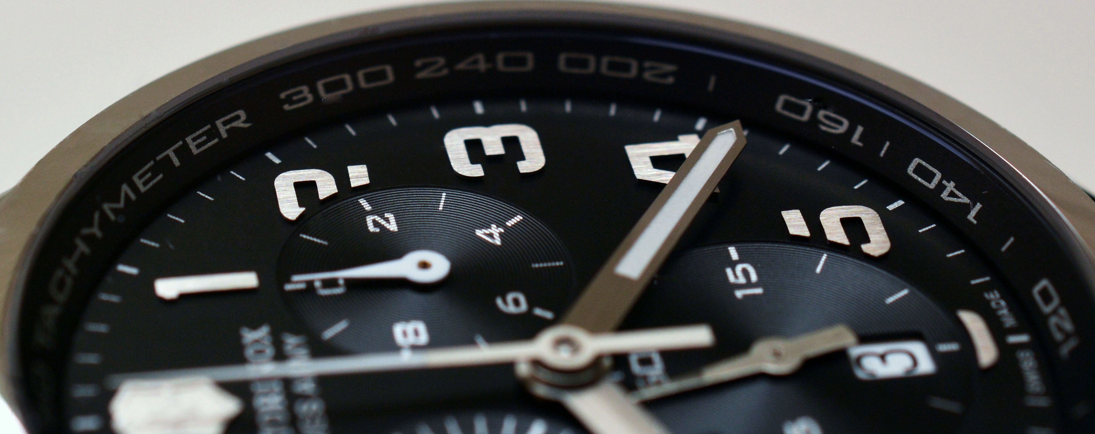 grey round chronograph watch