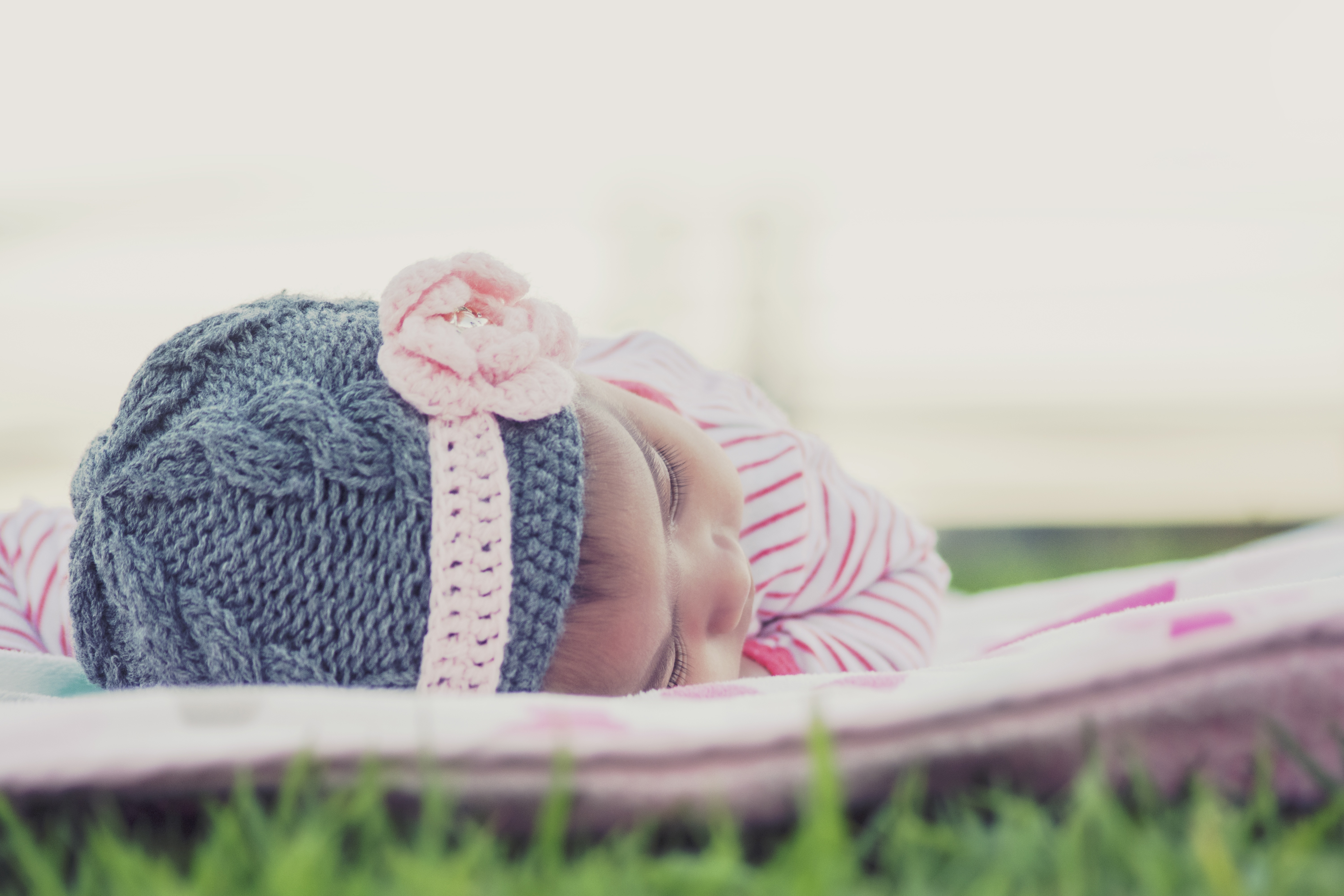 baby's gray knit cap and pink flower accent knit headband