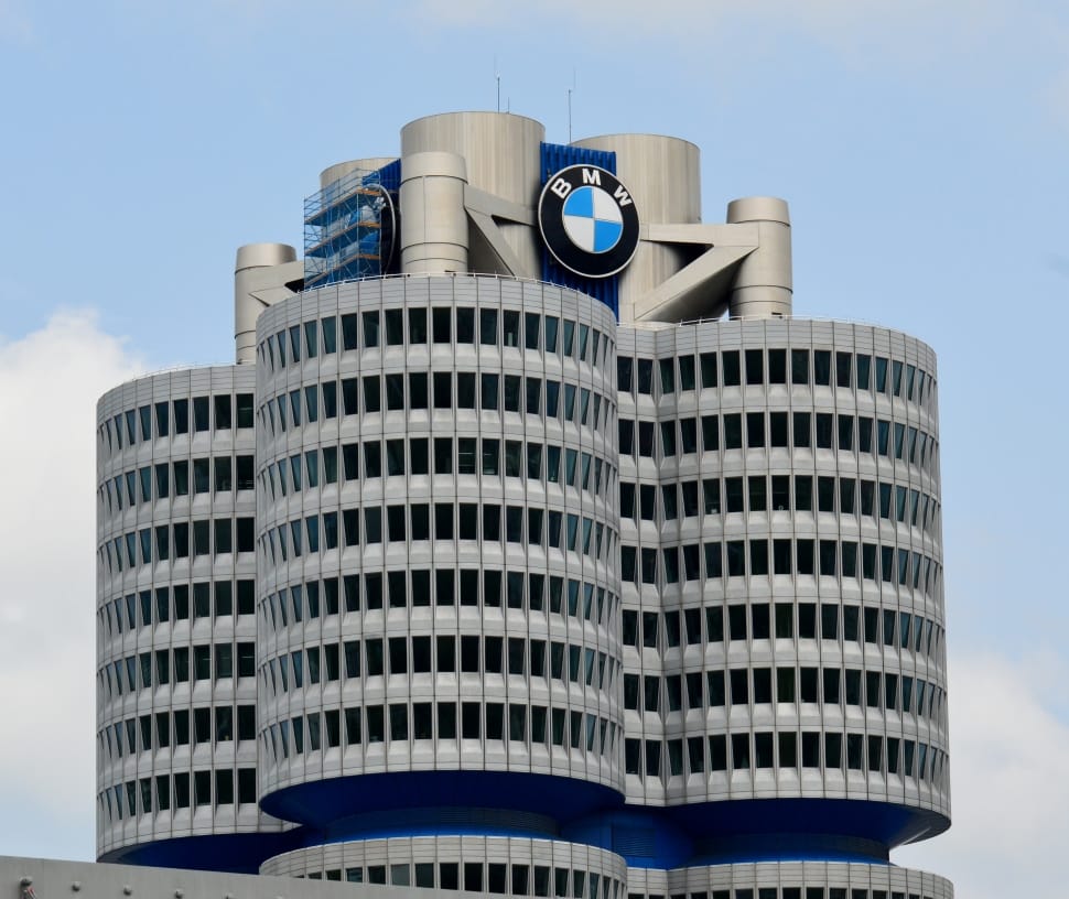 gray and blue bmw concrete building preview