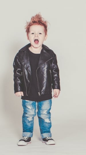 boy's black leather jacket, blue distressed jeans, and lace up low tops outfit thumbnail