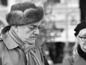 grayscale photo of man with winter hat and coat thumbnail