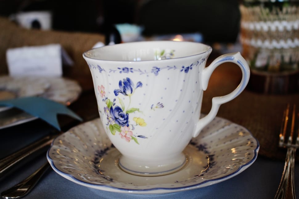white blue and green floral print ceramic teacup and dish set preview