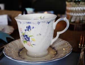white blue and green floral print ceramic teacup and dish set thumbnail