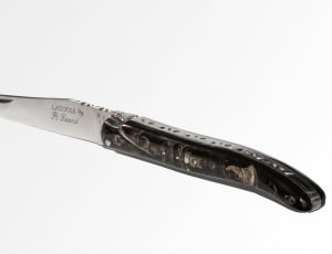 black handled silver knife thumbnail