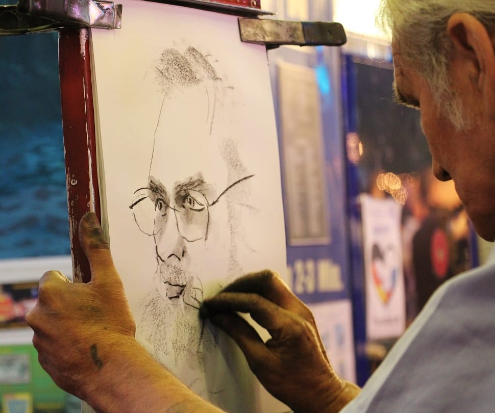 man wearing eyeglasses drawing sketch preview
