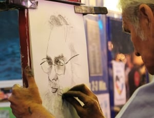 man wearing eyeglasses drawing sketch thumbnail