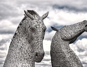 2 grey horse statues thumbnail