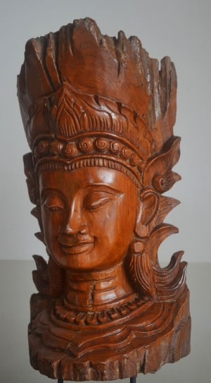 photo of brown wooden head bust sculpture thumbnail