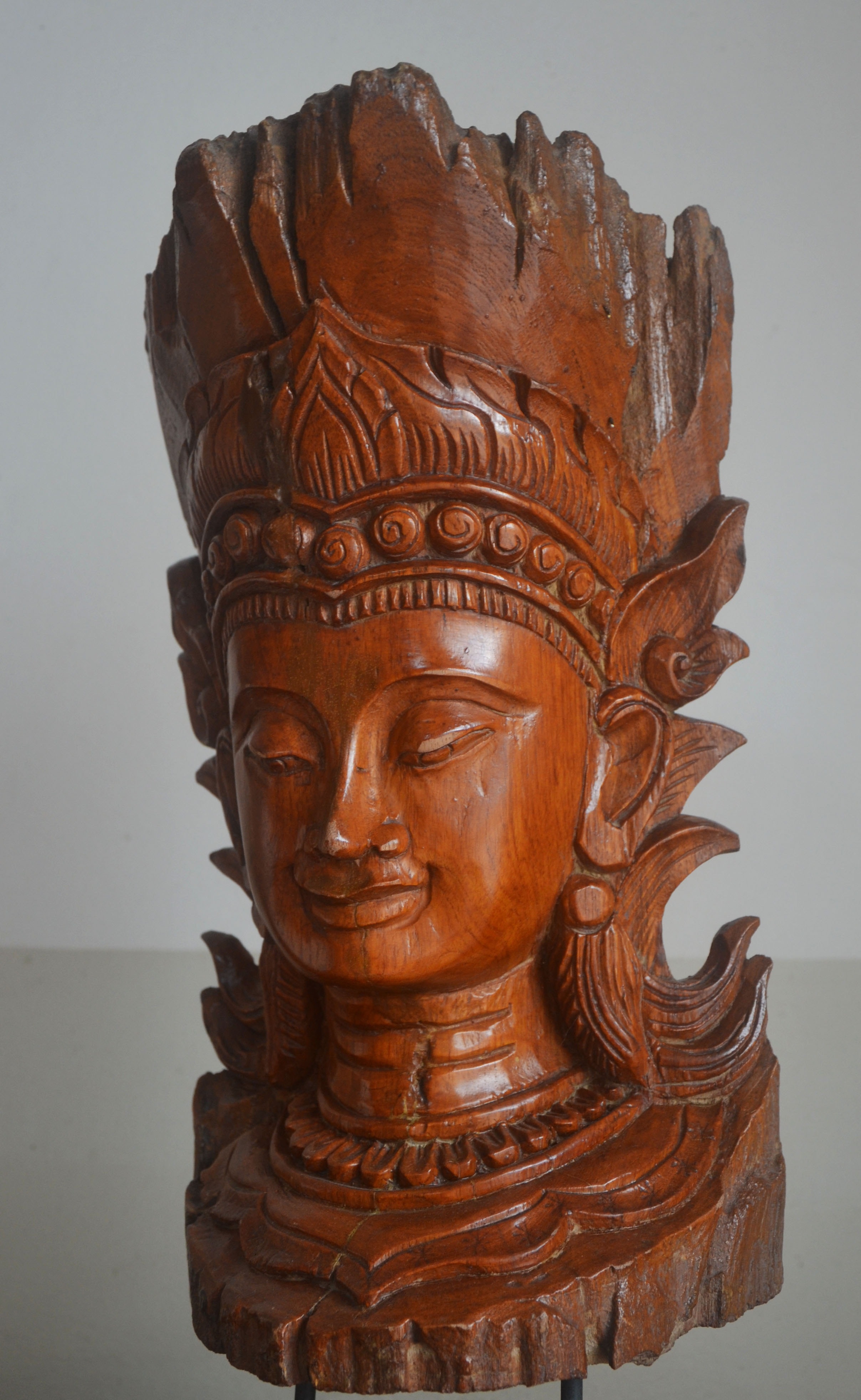 photo of brown wooden head bust sculpture