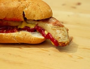 sausage in bun with ketchup and mustard thumbnail