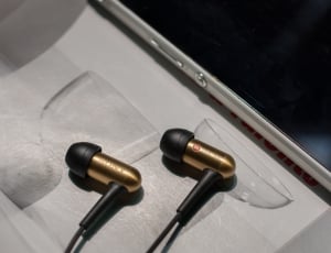 brown and black sony earbuds thumbnail