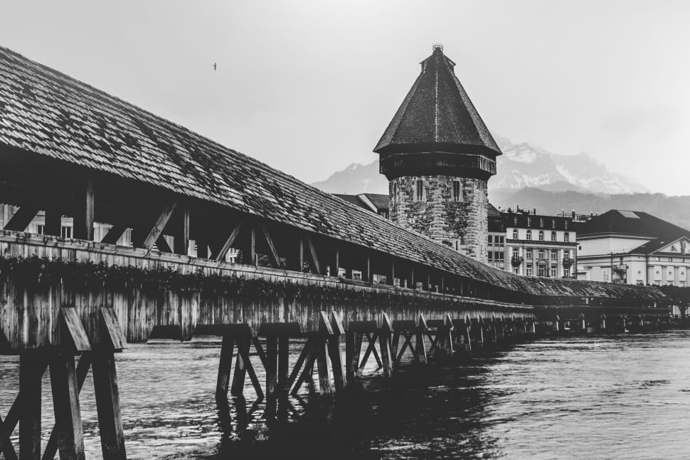greyscale photography of wooden bridge preview
