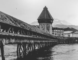 greyscale photography of wooden bridge thumbnail
