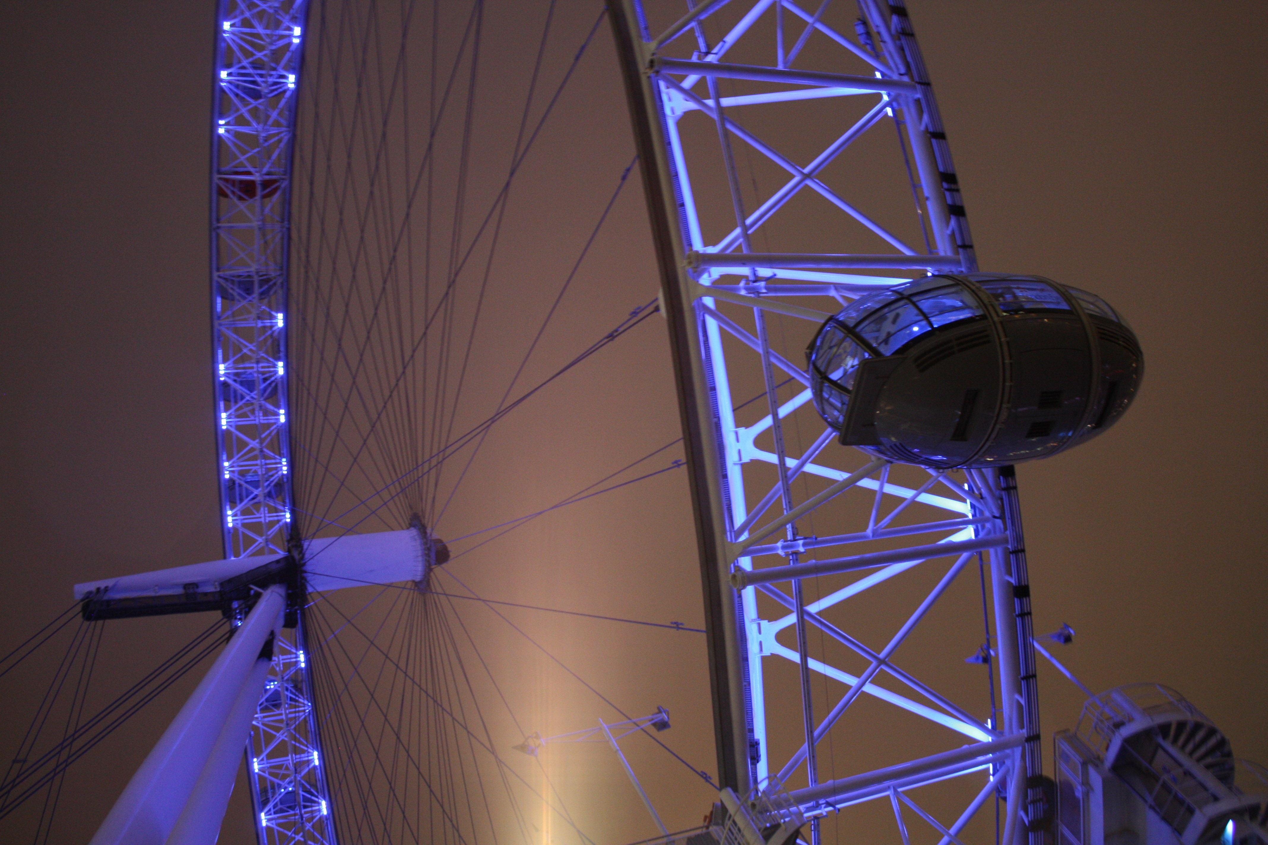 low angle view of white lighted ferris wheel