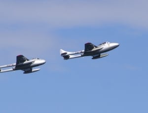 low angle photo of two grey fighter planes in flight thumbnail