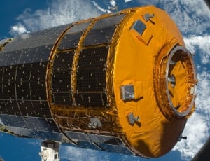 cylindrical orange and black outer space equipment thumbnail