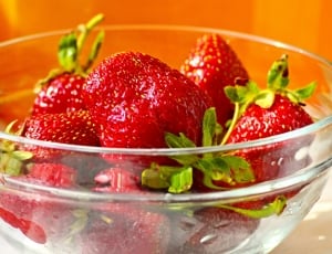 red strawberries in glass bowl thumbnail