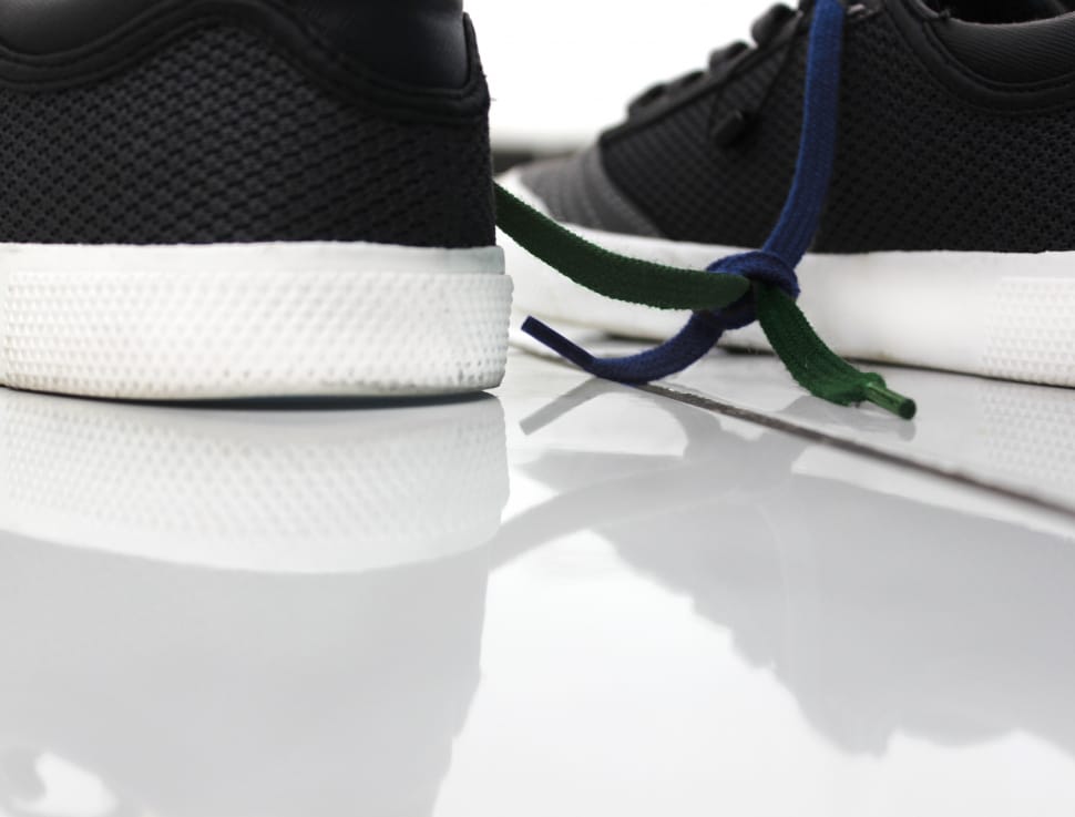shallow focus photography of black and white low tops sneakers preview