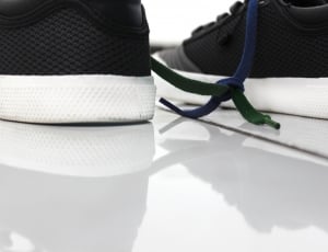 shallow focus photography of black and white low tops sneakers thumbnail