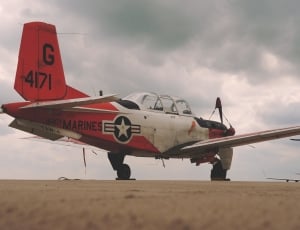 photograph of red and white airplane thumbnail