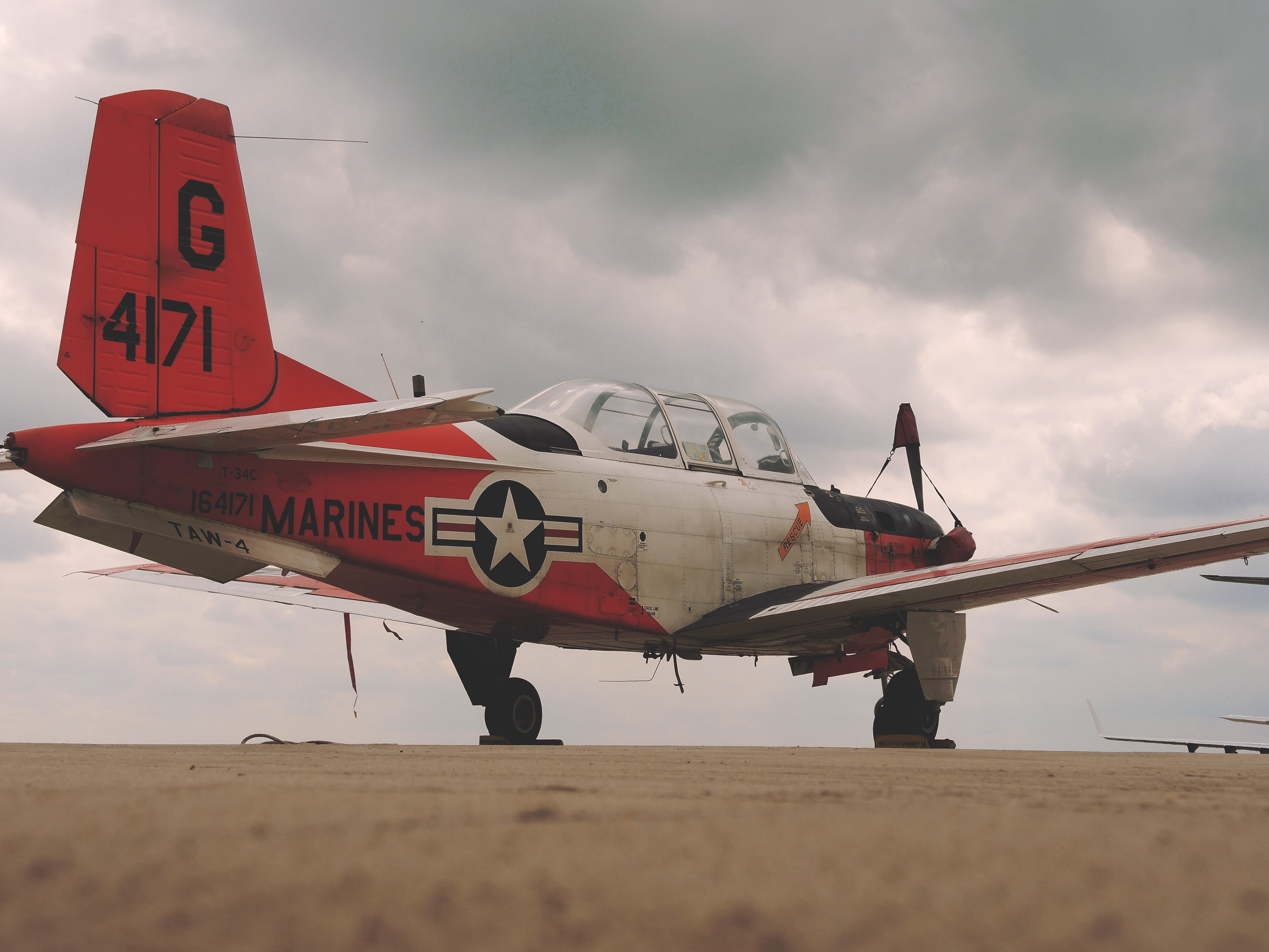 photograph of red and white airplane
