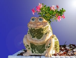 white and green floral frog figurine thumbnail