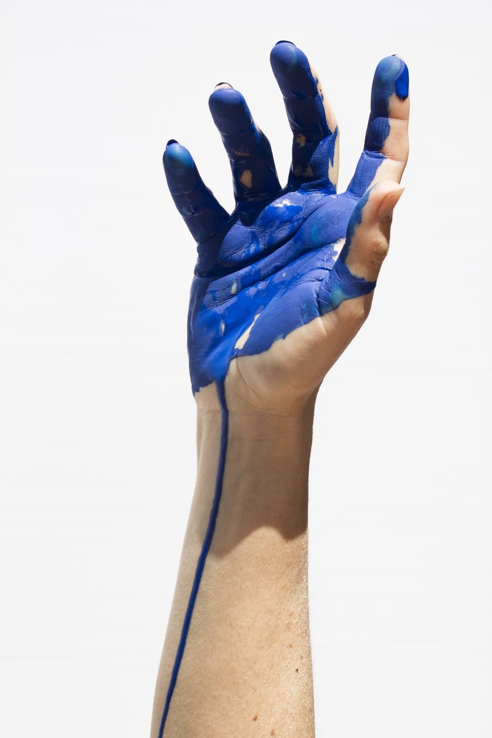 human hand with blue paint preview