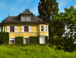 yellow painted two-storey house thumbnail