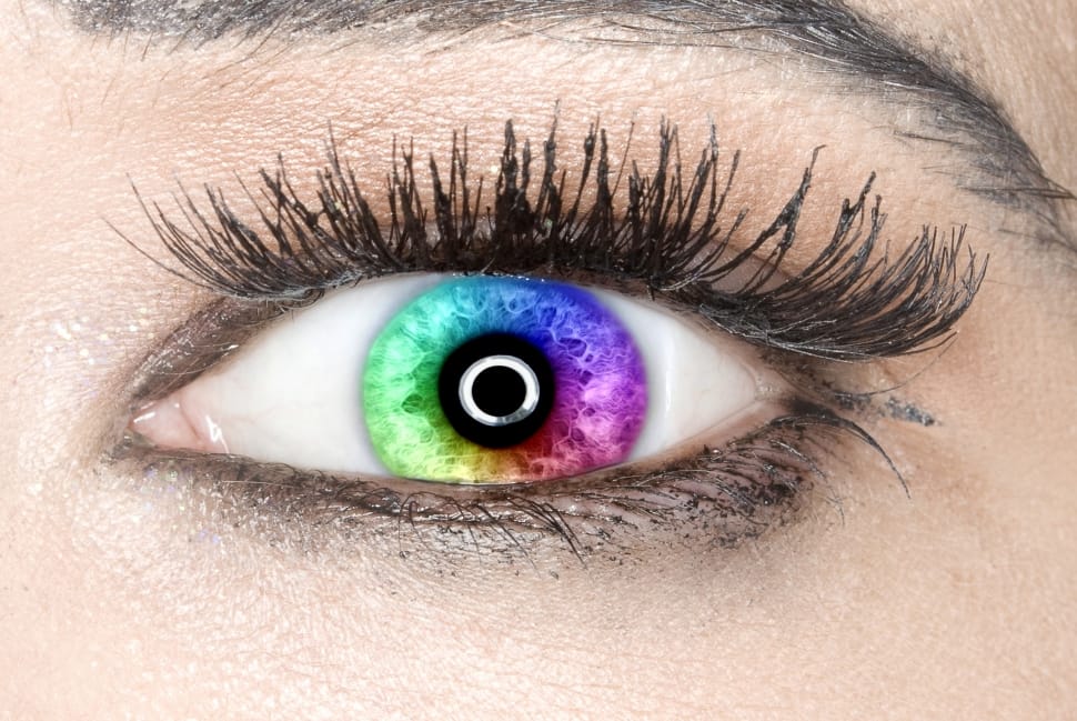 close up photo of person wearing multi-colored contact lens preview