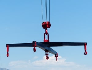 black and red pulley machine during daytime thumbnail